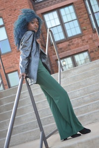 a woman leaning on a railing